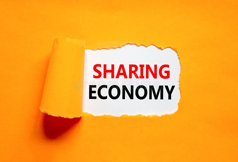 Sharing economy symbol. Concept words Sharing economy on beautiful white paper. Beautiful orange paper background. Business sharing economy concept. Copy space. Sharing economy symbol. Concept words Sharing economy on beautiful white paper. Beautiful orange paper background. Business sharing economy concept. Copy space