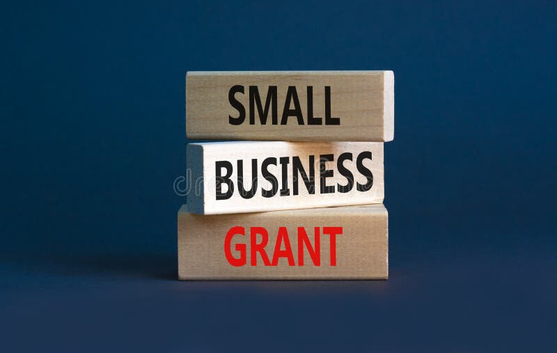 Small business grant symbol. Concept words Small business grant on wooden blocks on a beautiful grey table grey background. Business, finacial and small business grant concept. Copy space. Small business grant symbol. Concept words Small business grant on wooden blocks on a beautiful grey table grey background. Business, finacial and small business grant concept. Copy space