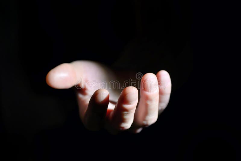 Symbolic hand helping on black background. Symbolic stock images, royalty-free photos and pictures