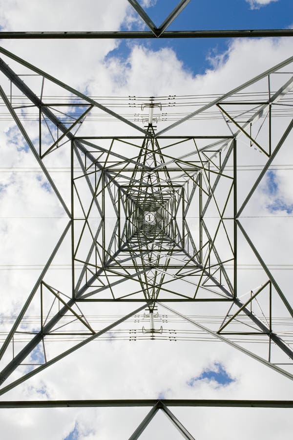 Symmetrical Image looking directly up the center of an electric pylon stock image