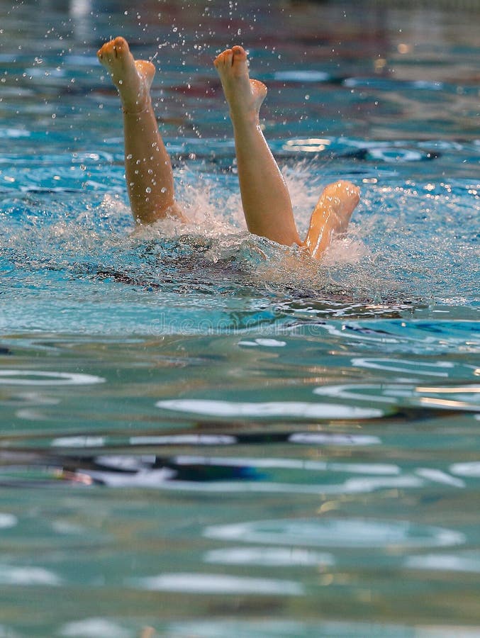 Synchronized swimming team practice vertical royalty free stock photography