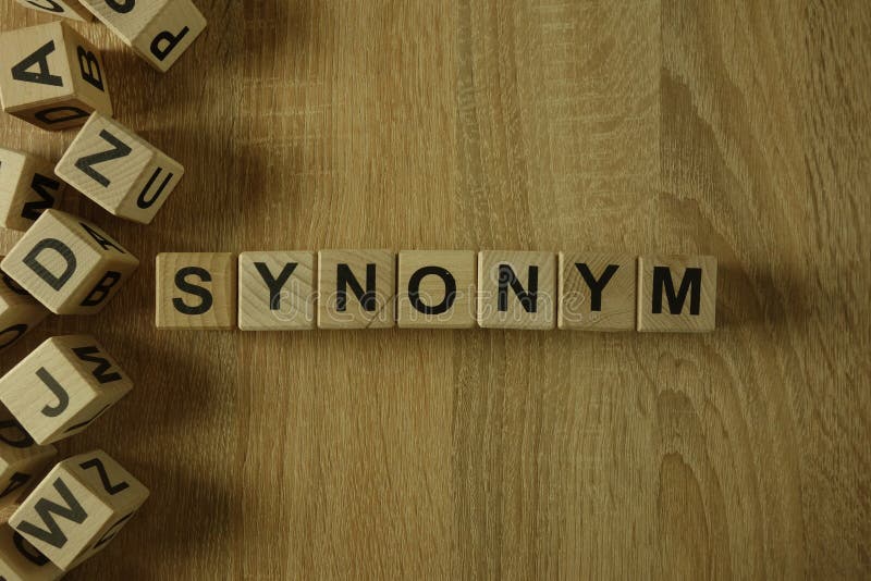 Synonym word from wooden blocks on desk