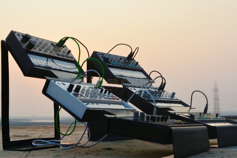 Synthesizer on stands outdoor with sunset in background stock image
