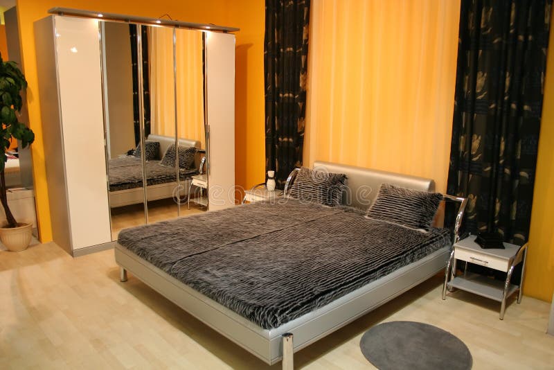 Bedroom with mirror closet, yellow walls. Bedroom with mirror closet, yellow walls