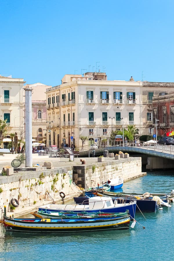 Syracuse, Sicily, Italy - Apr 10th 2019: View of small marina with boats between city Syracuse and famous Ortigia Island stock photos Syracuse, Sicily, Italy - Apr 10th 2019: View of small marina with boats between city Syracuse and famous Ortigia Island stock photos