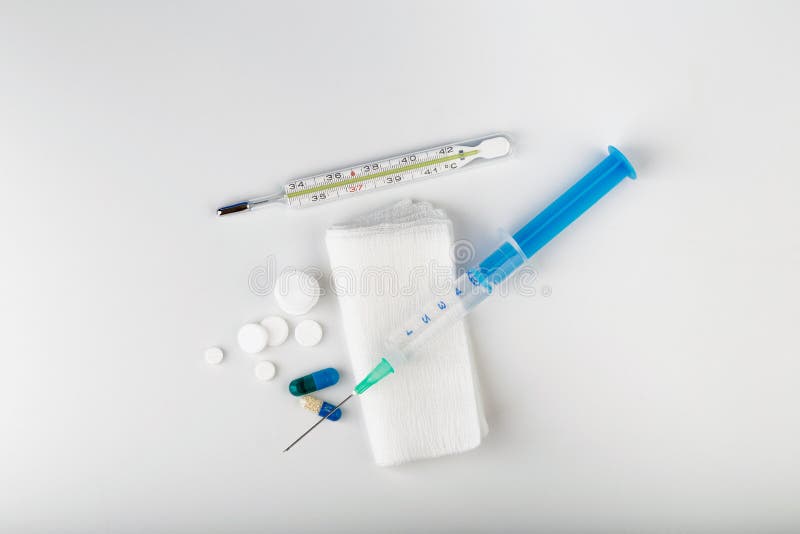 Syringe on Gauze with Drop on Top of Needle. Medical Tools Stock Photo