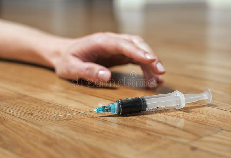 Syringe with heroin.