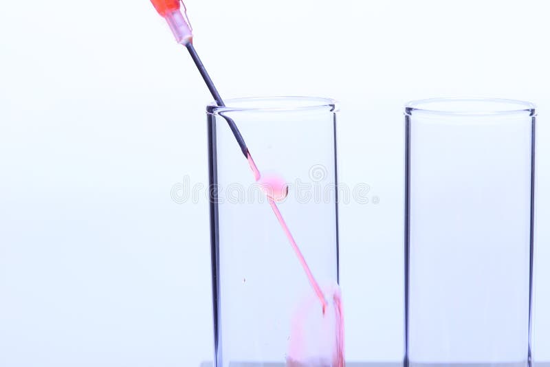 Syringe Inject Red Liquid into Glass Tube Lab Test Tools, Stock Photo