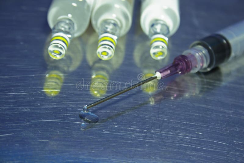 Syringe, needle and droplet