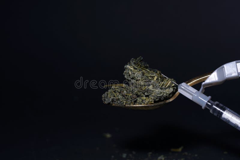 Syringe on Tea Leaves on a Teaspoon Stock Photo Image of drinking