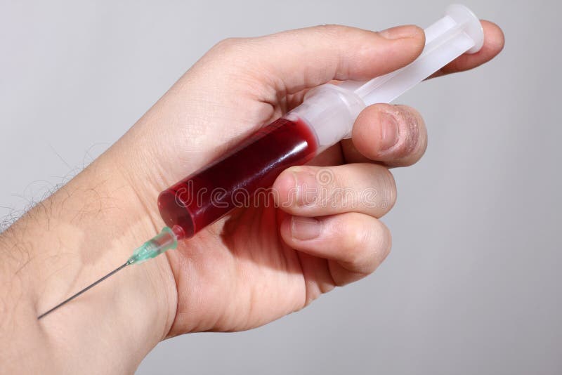 Syringes in hand stock photo. Image of medicine, chemistry 24055362