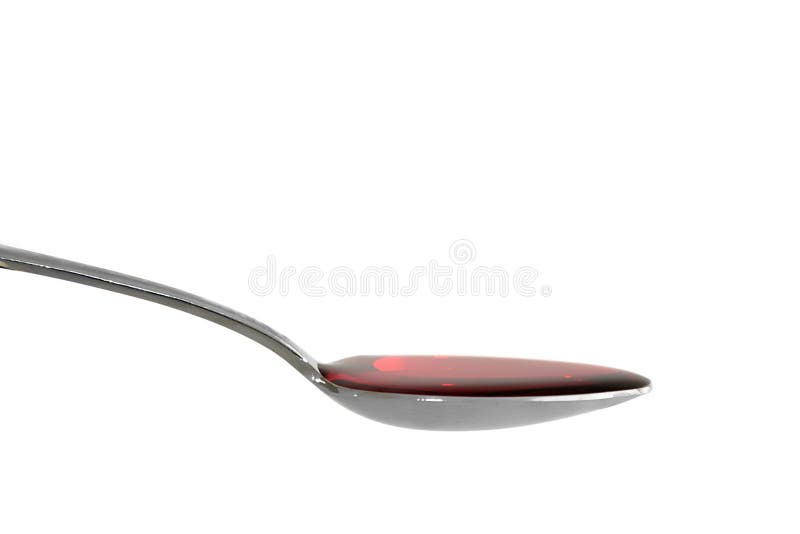 A spoonful of cough syrup, isolated on white. A spoonful of cough syrup, isolated on white