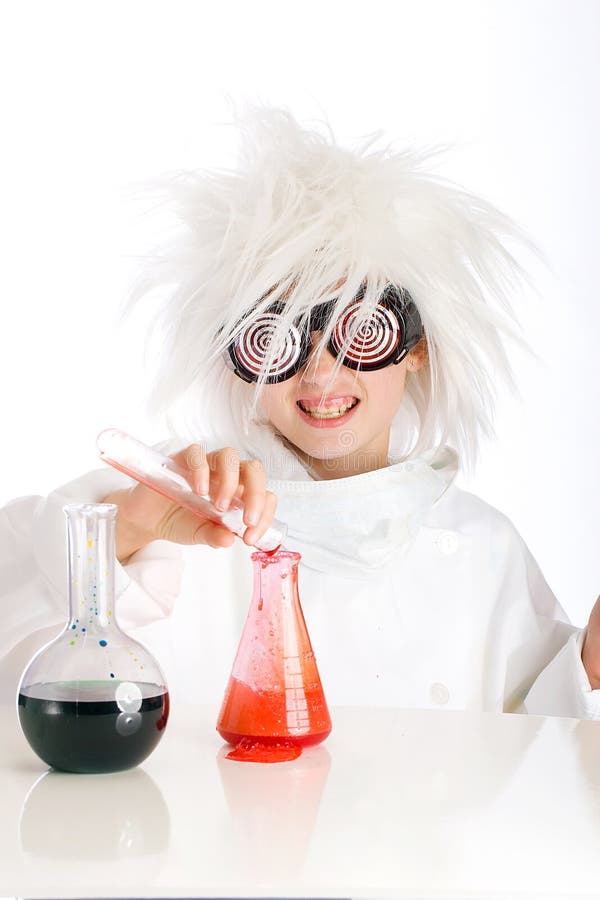 A child dressed as a mad scientist pours a bubbling red liquid into a beaker during a dangerous experimant in an all white laboratory. A child dressed as a mad scientist pours a bubbling red liquid into a beaker during a dangerous experimant in an all white laboratory.