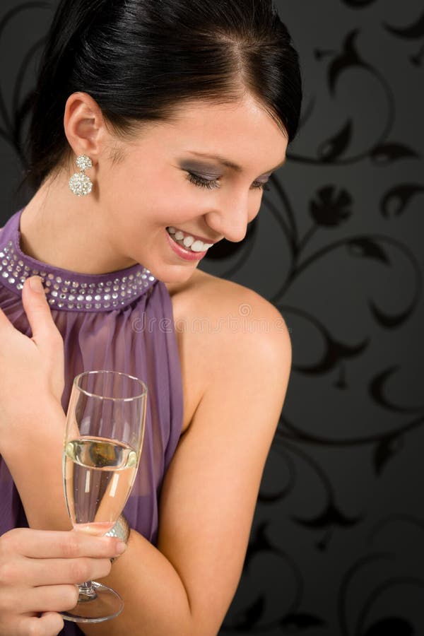 Woman party dress drink champagne glass glamorous look aside. Woman party dress drink champagne glass glamorous look aside