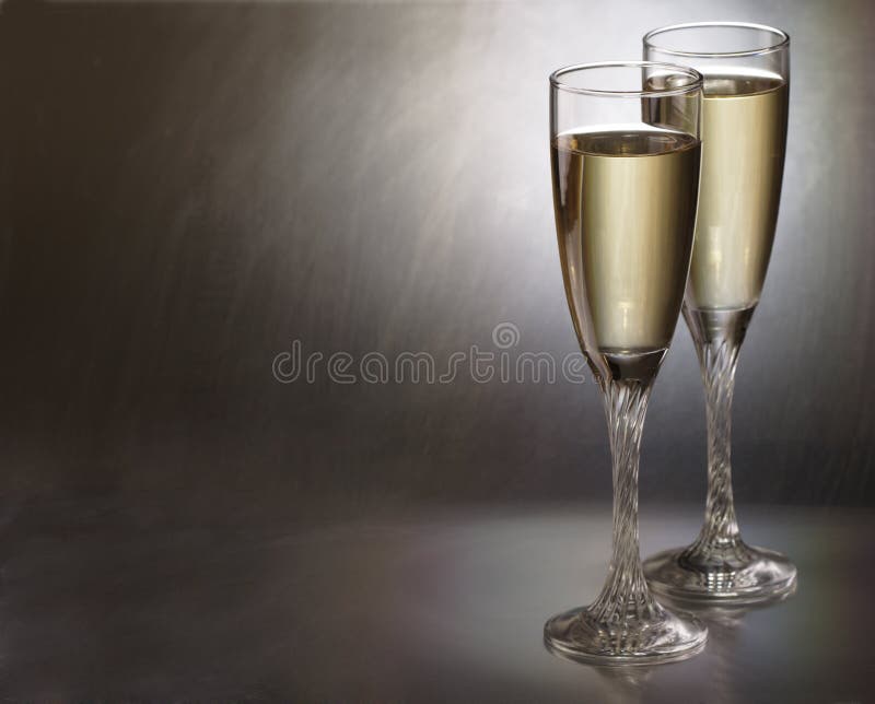 champagne glass on metal background. champagne glass on metal background