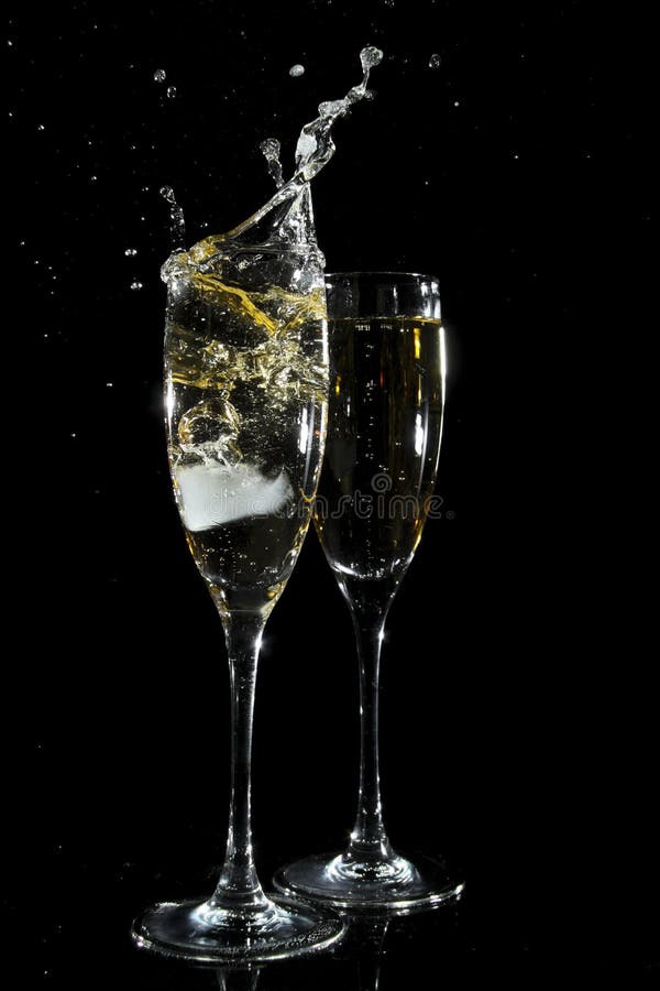 Champagne glass over black background. Champagne glass over black background