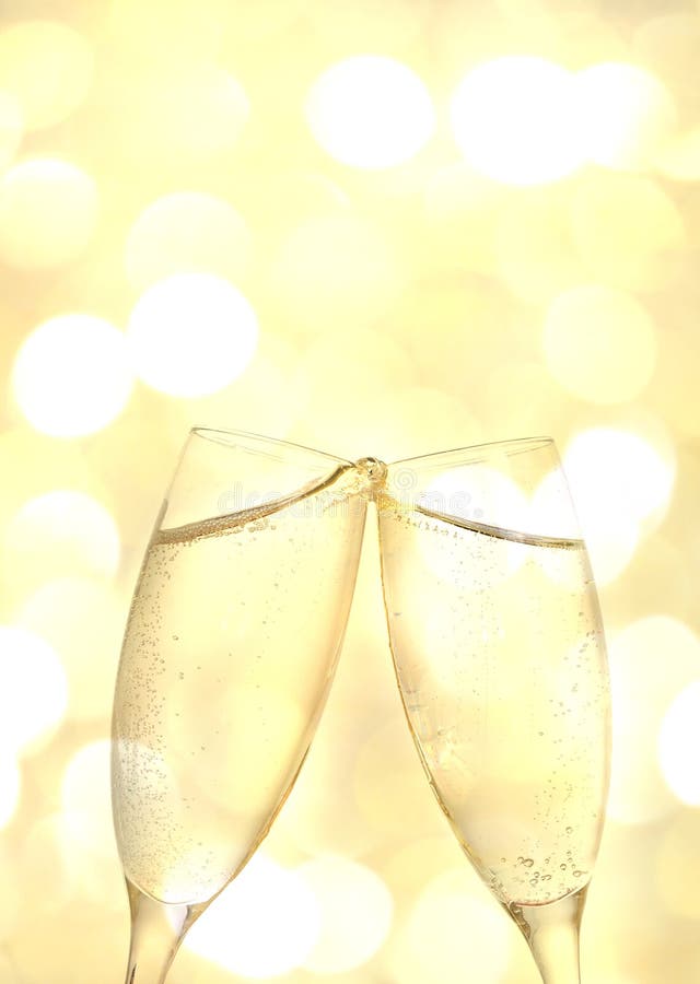 Two champagne glass in yellow abstract background with white circles. Two champagne glass in yellow abstract background with white circles
