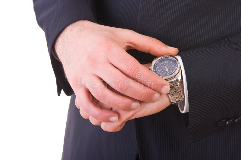 Biznesmen sprawdza czas na jego wristwatch. zdjęcie royalty free Biznesmen sprawdza czas na jego wristwatch. zdjęcie royalty free
