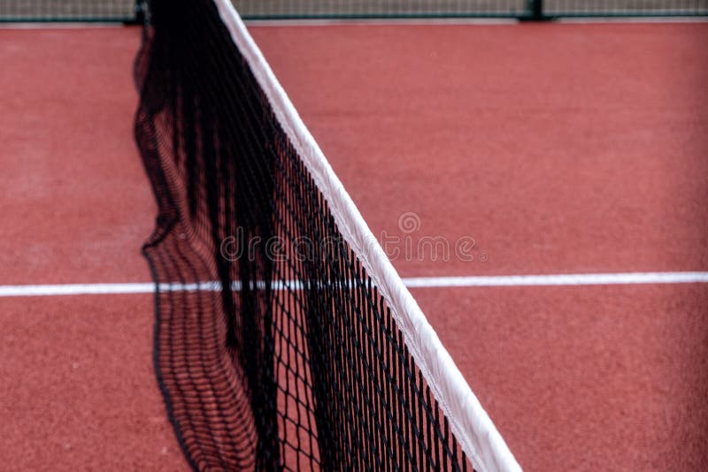 detail of the net of a red paddle tennis court, racket sports courts. detail of the net of a red paddle tennis court, racket sports courts