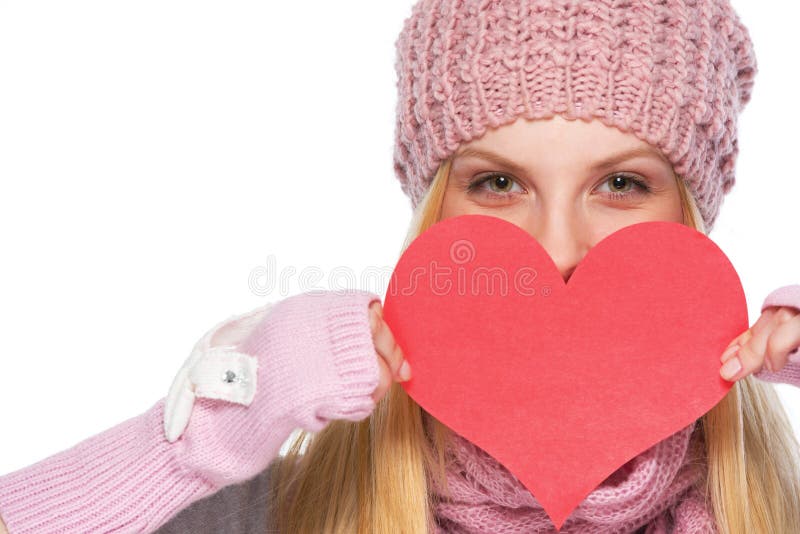 Szczęśliwa dziewczyna chuje za sercem kształtował valentines pocztówkowych obraz stock Szczęśliwa dziewczyna chuje za sercem kształtował valentines pocztówkowych obraz stock