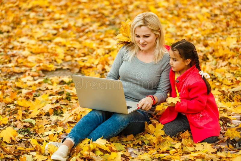 Happy mother and her tdaughter using. Happy mother and her tdaughter using