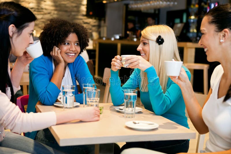 Happy girls on coffee break in cafe. Happy girls on coffee break in cafe