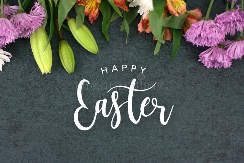 Happy Easter Text With Beautiful Colorful Flowers Bouquet Border Shot From Directly Above Over Black Dark Texture Background, Horizontal. Happy Easter Text With Beautiful Colorful Flowers Bouquet Border Shot From Directly Above Over Black Dark Texture Background, Horizontal
