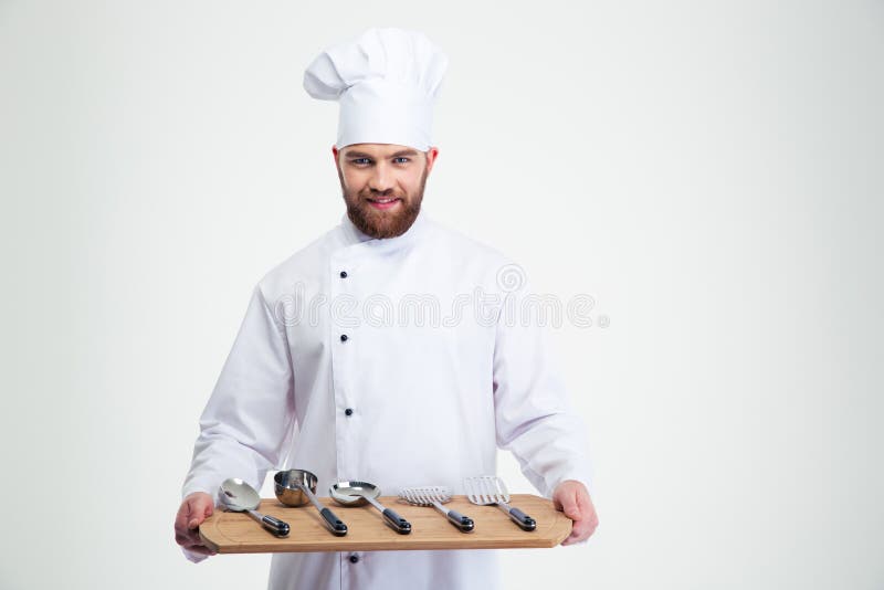 Szefa kuchni kucbarskiego mienia ciapania drewniana deska z łyżkami zdjęcia stock Szefa kuchni kucbarskiego mienia ciapania drewniana deska z łyżkami zdjęcia stock