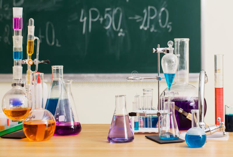 Glass flasks with multi-colored liquids at the chemistry lesson. Glass flasks with multi-colored liquids at the chemistry lesson