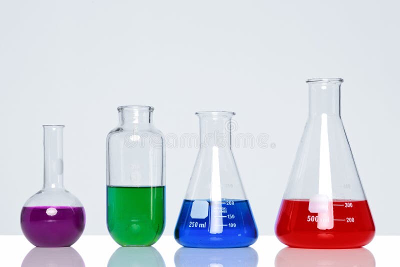 Photo of chemicals in glass flasks and beakers. Photo of chemicals in glass flasks and beakers