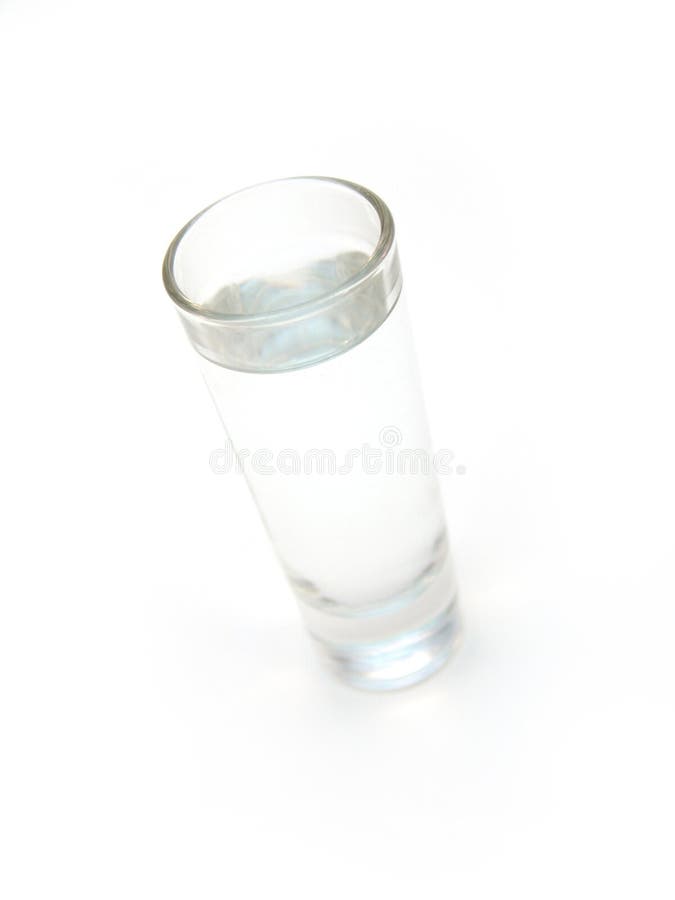 Shot glass isolated over white with clear liquid (vodka). Shot glass isolated over white with clear liquid (vodka)