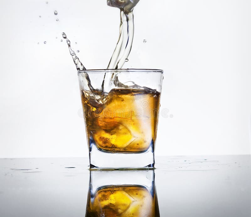 Splashed whisky in transparent glass. Splashed whisky in transparent glass