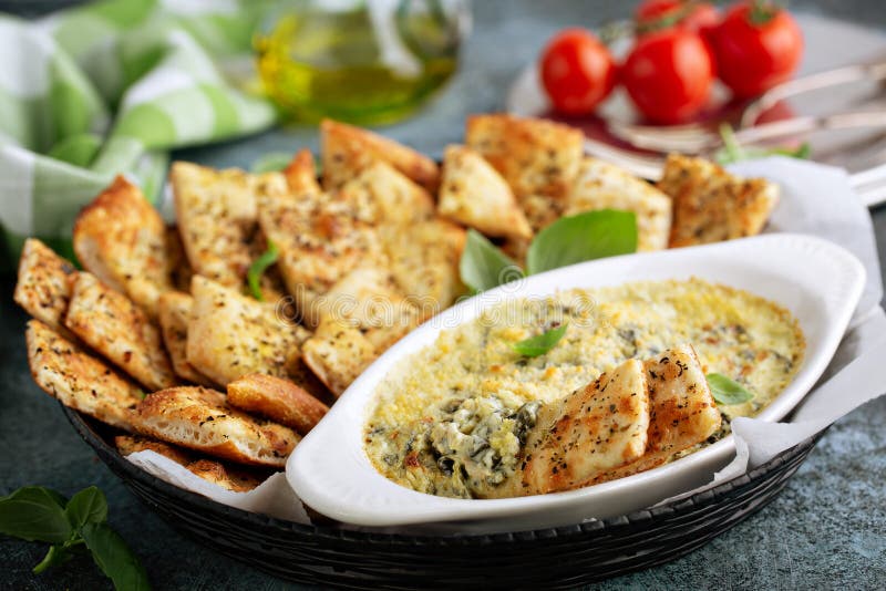 Artichoke spinach dip in a baking dish. Artichoke spinach dip in a baking dish