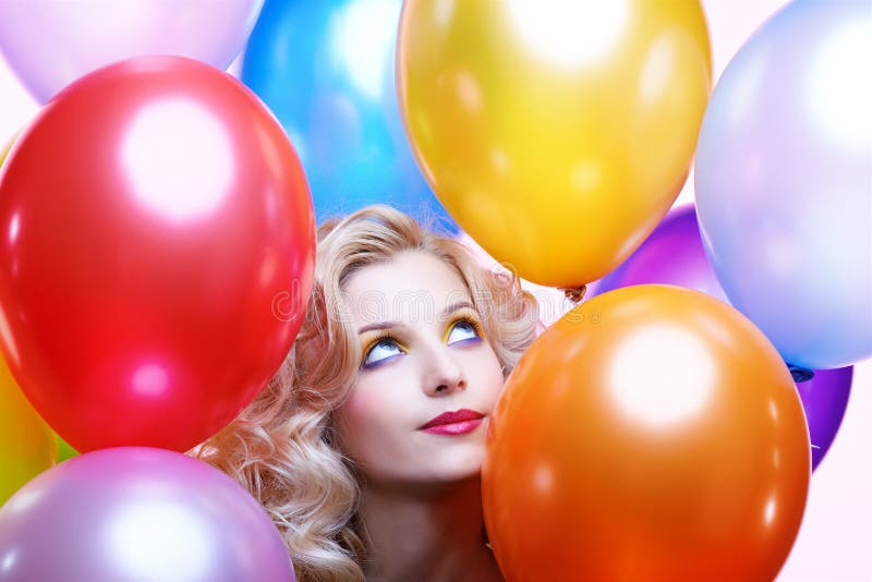 Portrait of beautiful blonde girl with balloons celebrating birthday. Portrait of beautiful blonde girl with balloons celebrating birthday