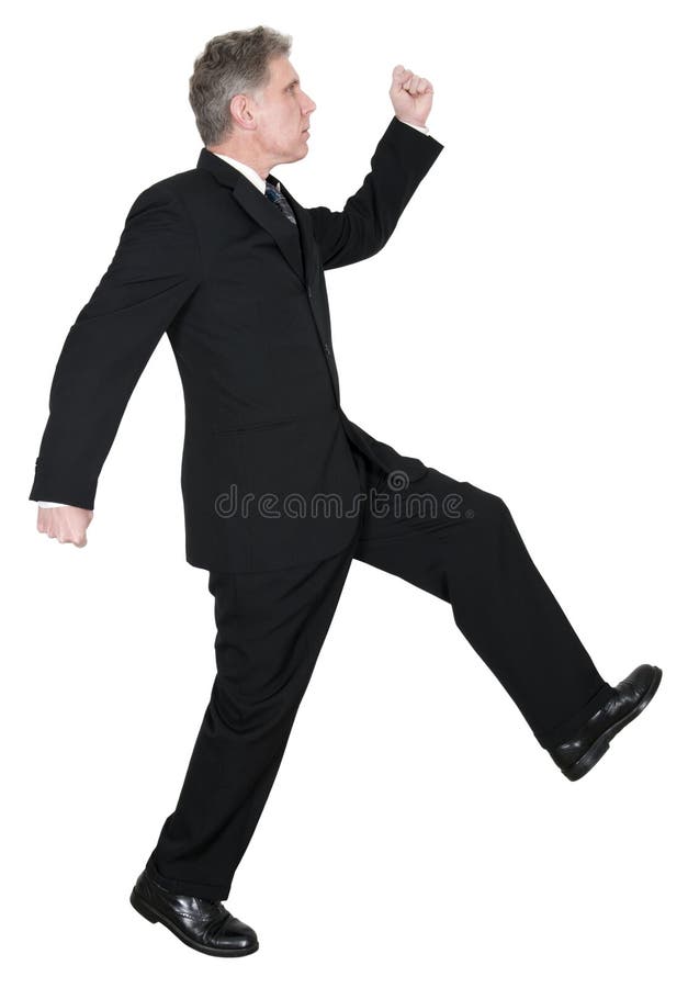 A businessman dressed in a suit and tie walks with confidence. He is confident and filled with pride and purpose. Isolated on white. A businessman dressed in a suit and tie walks with confidence. He is confident and filled with pride and purpose. Isolated on white.