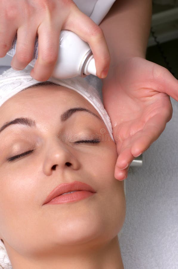 Woman getting extra hydration procedure before skin cleaning at beauty salon. Woman getting extra hydration procedure before skin cleaning at beauty salon