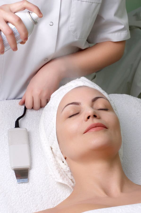 Woman getting extra hydration procedure before skin cleaning at beauty salon. Woman getting extra hydration procedure before skin cleaning at beauty salon