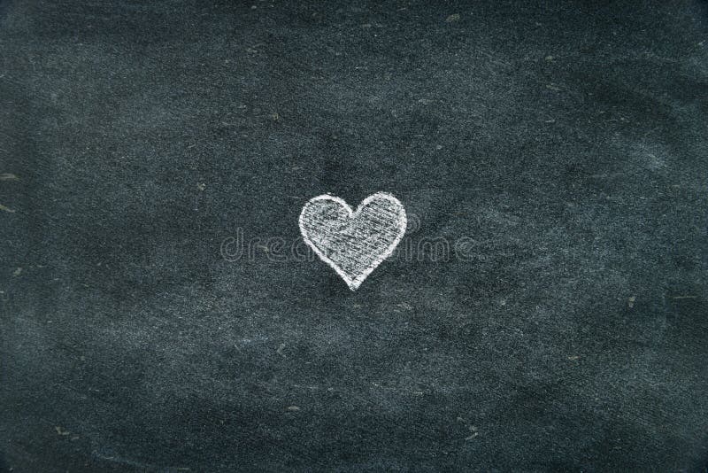 Hand drawing heart shape symbol filled with white on blackboard as design resource, copy paste available. Hand drawing heart shape symbol filled with white on blackboard as design resource, copy paste available