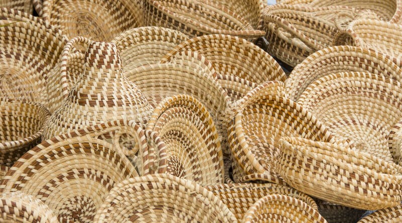 A collection of hand woven baskets crafted from sweet grass. A collection of hand woven baskets crafted from sweet grass