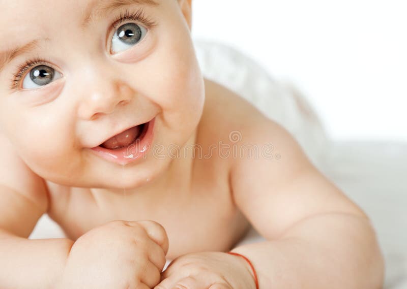 Süßes Schätzchengesichtslächeln stockbild Süßes Schätzchengesichtslächeln stockbild