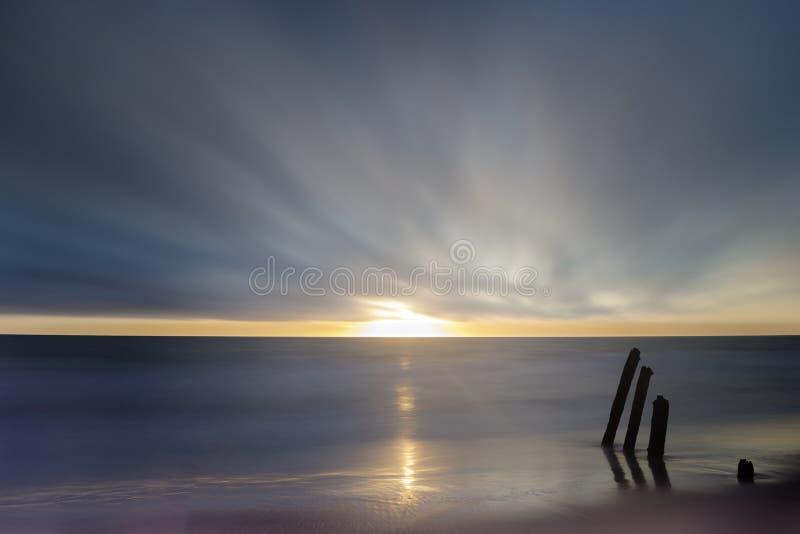 Sunset over the Pacific Ocean and an old pier in Fort Funston, San Francisco, California, USA. Sunset over the Pacific Ocean and an old pier in Fort Funston, San Francisco, California, USA.