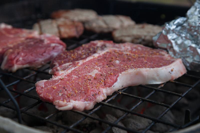 T-Bone Steaks On Charcoal Grill Stock Image - Image of ...