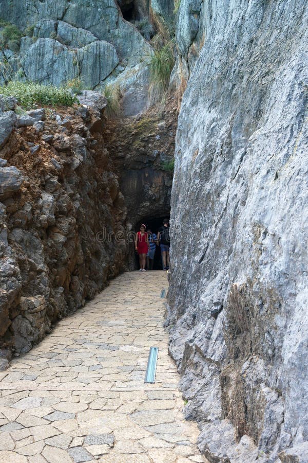 The famous pebble-sandy beach of Sa Calobra on the west coast of Mallorca. Tunnel through the rock to. T Mallorca, Spain, July 2019. he famous pebble-sandy stock image The famous pebble-sandy beach of Sa Calobra on the west coast of Mallorca. Tunnel through the rock to. T Mallorca, Spain, July 2019. he famous pebble-sandy stock image