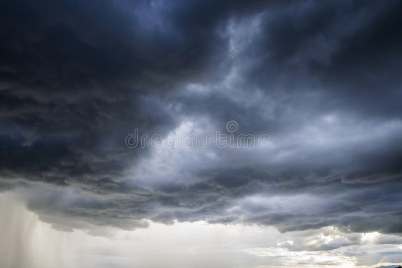 Light in the Dark and Dramatic Storm Clouds background, Black cumulus clouds before the beginning of a strong storm atmosphere backdrop beautiful blue bright climate cloudscape cloudy cyclone danger disaster dusk evening gray heaven hurricane landscape lightning moody natural nature nobody ominous outdoors overcast pattern power rain scene scenic season sky smoke stormy strike summer thunder thunderstorm view weather wild wind. Light in the Dark and Dramatic Storm Clouds background, Black cumulus clouds before the beginning of a strong storm atmosphere backdrop beautiful blue bright climate cloudscape cloudy cyclone danger disaster dusk evening gray heaven hurricane landscape lightning moody natural nature nobody ominous outdoors overcast pattern power rain scene scenic season sky smoke stormy strike summer thunder thunderstorm view weather wild wind