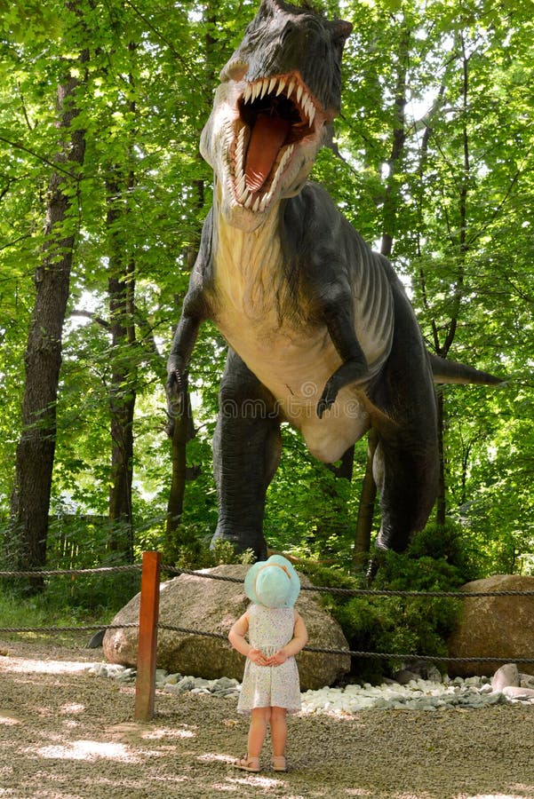 Huge T-Rex dinosaur and a baby watching. Picture taken in Dinosaur Park in Lesser Poland.