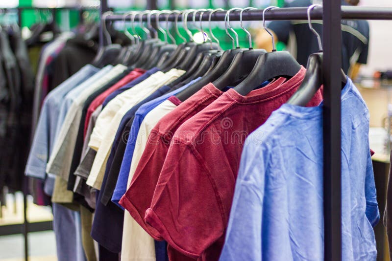 Many T-shirt for the Man on Hangers Stock Photo - Image of sale, casual ...