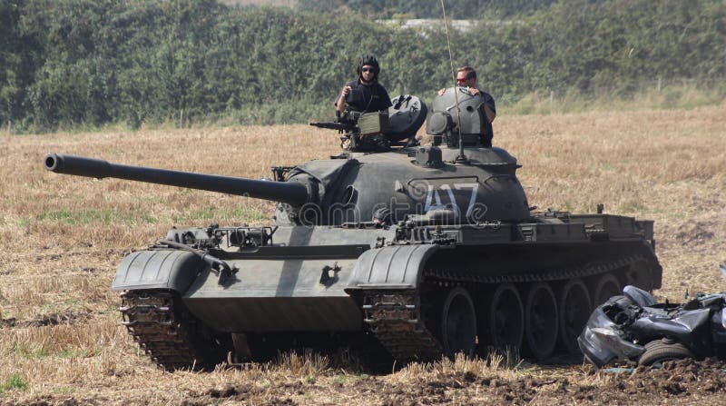 t-tank-t-tank-tank-soviet-russian-russianilitary-army-coldwar-soviettank-russiantank-mbt-mainbattletank-t-tank-passing-crushed-car-157079866.jpg