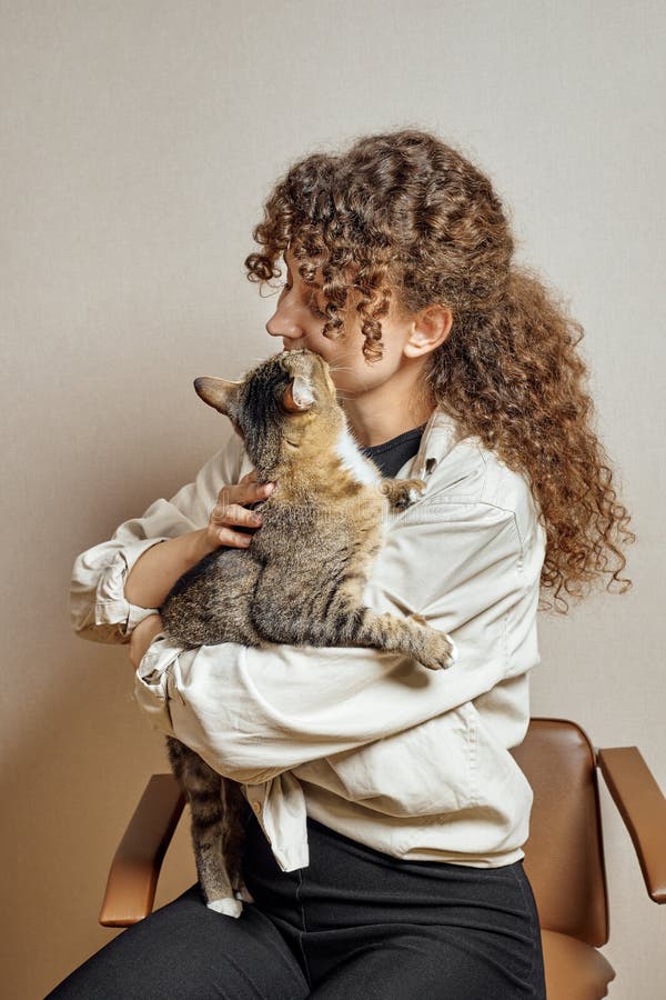 Tabby cat kisses his owner royalty free stock photo