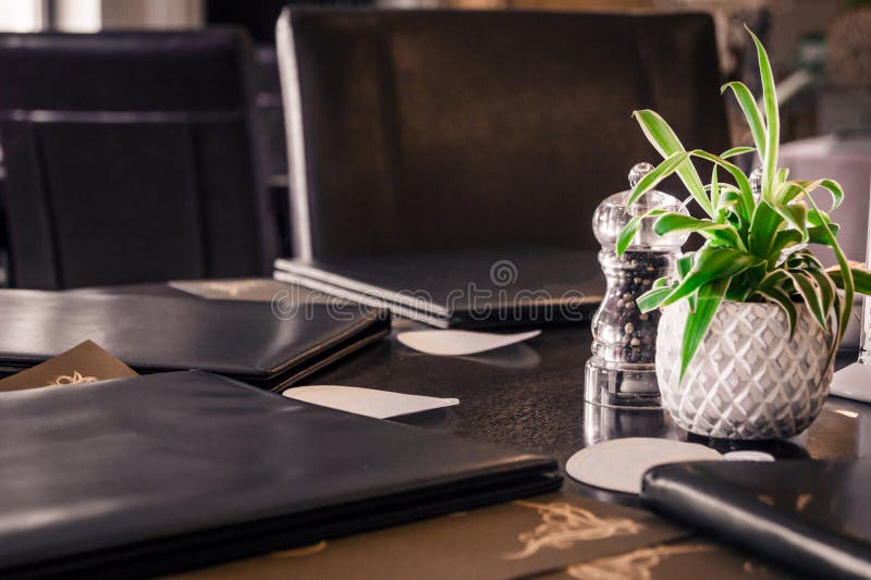 A Table Close Up With Restaurant Menu And Table Decoration. A Table Close Up With Restaurant Menu And Table Decoration.