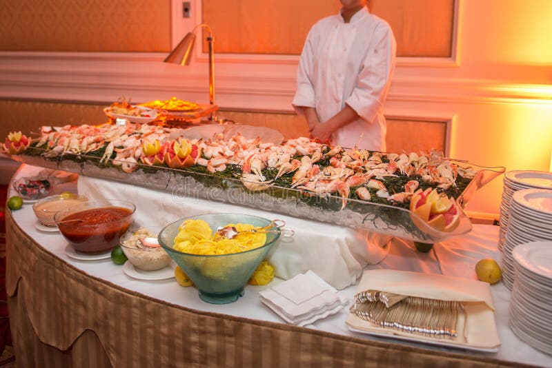 Buffet table with seafood with shrimp and crabs on luxury event banquet. Catering service concept. Buffet table with seafood with shrimp and crabs on luxury event banquet. Catering service concept